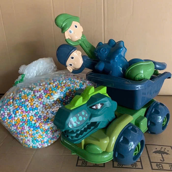 Hạt sứ và Ô tô khủng long xúc cát